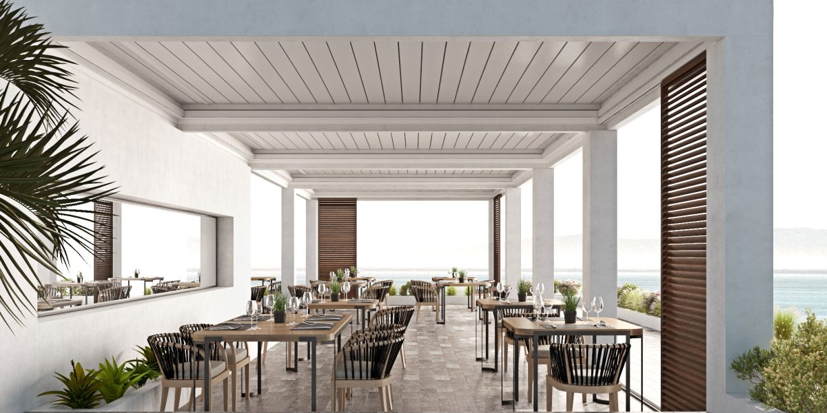 Pergola bioclimatica bianca nella terrazza di un ristorante sul mare.